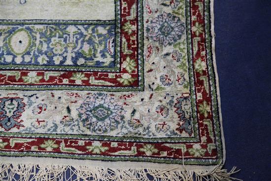 A Panderma part silk pale green/grey ground prayer rug, 5ft 4in by 3ft 6in.